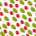 Pattern with tomato cherry and basil leaves on a white background Royalty Free Stock Photo