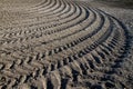 Pattern of tractor tracks on the ground. Royalty Free Stock Photo