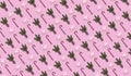 Pattern of Traditional Christmas candy cane marshmallows snowflake green fir branches on pink background flat lay top view.