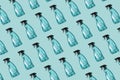 Pattern of transparent plastic bottle of cleaning product, household window cleaning liquid on blue background.