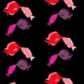 Pattern. Two pairs of lovers, lovely, beautiful, red, pink, purple fish stitched with white threads kiss on a black background on Royalty Free Stock Photo