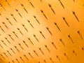 The pattern of a variety of metal forks, cutlery on the wall on a yellow background. Texture