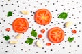 Pattern of vegetables. Food background. Composition of tomatoes, chili peppers, parsley, garlic and spices on white background. Royalty Free Stock Photo