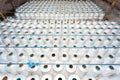 A pattern of white cotton spools with threads. An old system manual loom machine for clothing Royalty Free Stock Photo