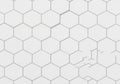 A pattern of white hexagonal tiles arranged in a uniform grid on a Royalty Free Stock Photo