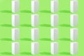 Pattern with white rectangular boxes with shadows on a light green background