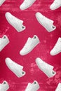 Pattern of white sneakers isolated on Viva Magenta grunge background.