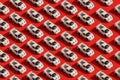 Pattern of white toy car model Ferrari on red background Royalty Free Stock Photo