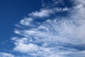 Pattern of white wispy clouds in blue sky Royalty Free Stock Photo