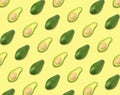 Pattern of whole and halved avocados on pale background