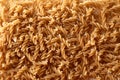 Pattern of wholegrain spelt fusilli. Abstract background