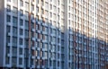 Pattern from the windows of a new multi-storey building. Window in modern architecture. Apartment house, new building Royalty Free Stock Photo