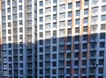 Pattern from the windows of a new multi-storey building. Window in modern architecture. Apartment house, new building Royalty Free Stock Photo