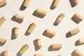 Pattern with wine corks from white and red wine on beige pastel color background with shadow at sunlight. Trend layout Royalty Free Stock Photo