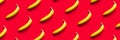 Pattern of yellow bananas on a red background. Royalty Free Stock Photo