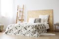 Patterned bedsheets on king-size bed