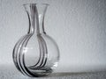 A patterned clear glass flask