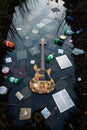 abandoned electric guitar floating among trash in polluted water Royalty Free Stock Photo