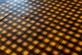 A patterned floor with a shadow cast on it