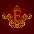 Patterned golden letter E monogram in vintage style. Heraldic coat of arms. Baroque logo template