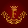 Patterned golden letter F monogram in vintage style. Heraldic coat of arms. Baroque logo template