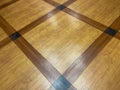 Patterned hardwood floor in a lobby of a condomium building