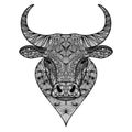 Patterned head of bull or ox. Taurus, buffalo painted tribal ethnic ornament. Hand drawn coloring book in ornate doodle style.