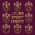 Patterned medieval coat of arms kit. Golden letters and ornamental wreath frames for creating initial logo