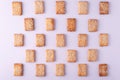 patterned mosaic of cookies with sesame seeds on a white background