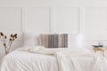 King size bed in white simple bedroom interior, real photo Royalty Free Stock Photo