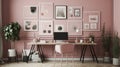 Patterned poster on table with computer monitor in Pink home office interior with plants Royalty Free Stock Photo
