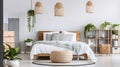 Patterned Pouf and Basket Aligned with Lamps, Plants, and Poster in the Bedroom Royalty Free Stock Photo