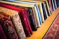 patterned prayer mats arranged neatly for a religious event