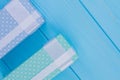 Patterned printed gift boxes on blue wood. Royalty Free Stock Photo