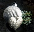 Patterned silver Christmas bauble and heart Royalty Free Stock Photo