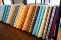 patterned upholstery fabric swatches arranged by color