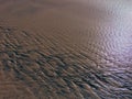 Patterns created ÃÂ¾n the sand by waves and wind, sand pattern Royalty Free Stock Photo