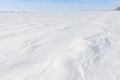 Patterns on a fresh snow texture on a field Royalty Free Stock Photo