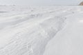 Patterns on a fresh snow texture on a field Royalty Free Stock Photo