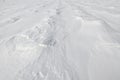 Patterns on a fresh snow texture on a field Royalty Free Stock Photo