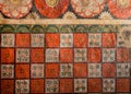 Patterns of the old fresco, flowers and colorful decor on ceiling of Buddha ancient temple. Sri Lanka religious artwork