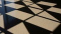 Patterns of shadows create a diamond shaped design on a speckled Royalty Free Stock Photo