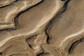 Patterns on a wet sand beach. Abstract natural background Royalty Free Stock Photo