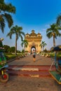 Patuxai Monument Vientiane Laos Girl tourist takes photos of the Victory Gate Royalty Free Stock Photo