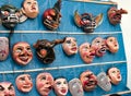 Traditional festival masks hanging on a wall from Paucartambo`s religious festival of Virgen del Carmen.