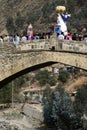 PAUCARTAMBO PERU procession of the Virgen del Carmen carried through the streets and the historic bridge