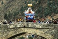 PAUCARTAMBO PERU procession of the Virgen del Carmen carried through the streets and the historic bridge over the river of the