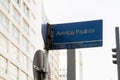 Paulista Avenue sign with mirrored buildings in the background during the day. Royalty Free Stock Photo