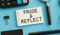 Pause and Reflect . planner page and notepad on desktop. text on the page. Business Concept. Royalty Free Stock Photo