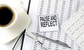 PAUSE AND REFLECT text on sticky on the chart with coffee,pen and calculator Royalty Free Stock Photo